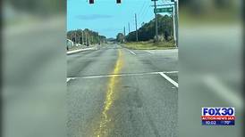 Another mysterious yellow line appears on a St. Johns County road, local drivers concerned