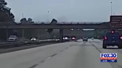 Video: Driver cited after truck falls off Clark Road overpass and onto I-95 in Jacksonville